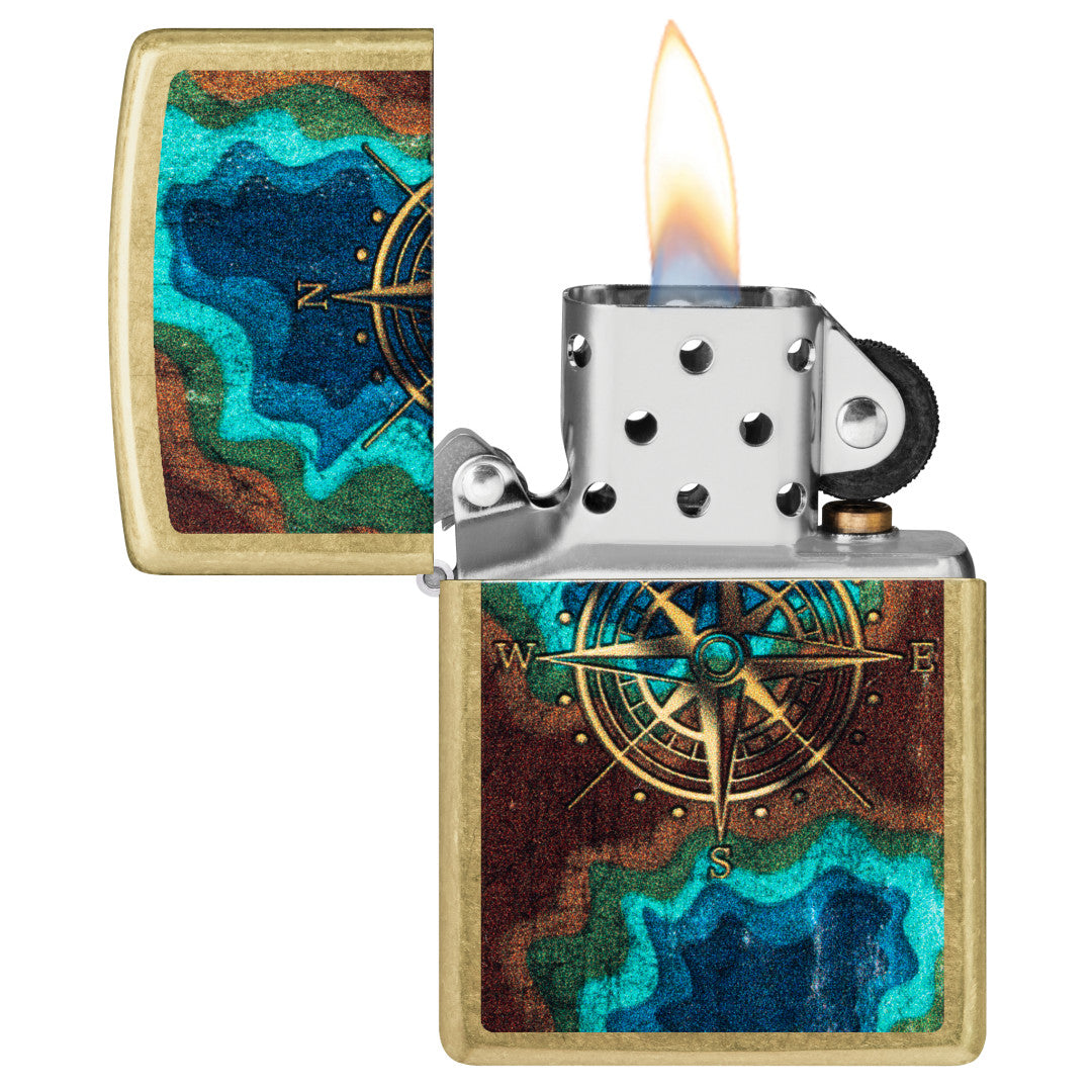 Zippo Topo Compass Design Street Brass Windproof Lighter with its lid open and lit.