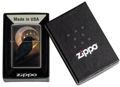 Zippo Raven Moon Design Grey Windproof Lighter in its packaging.