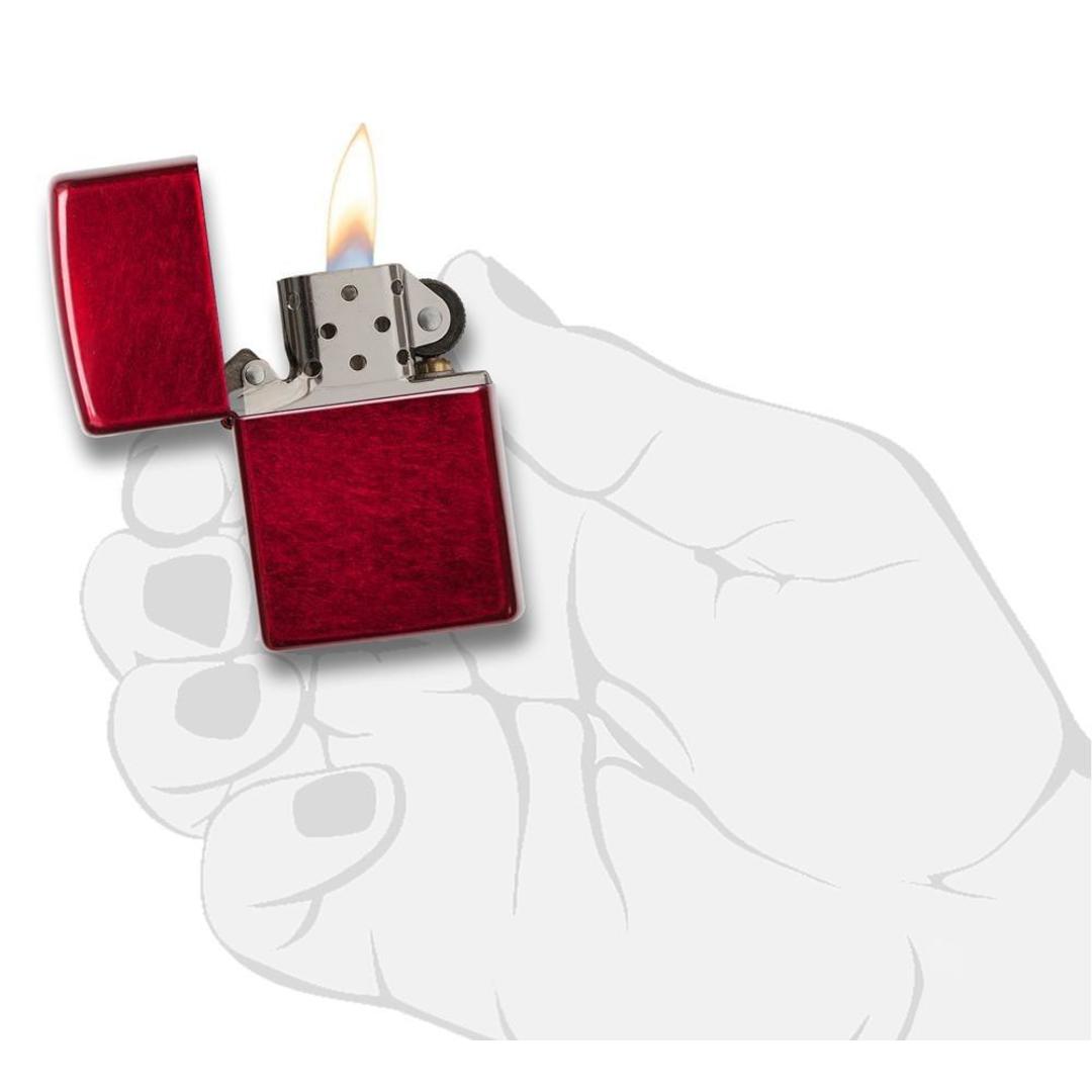 Classic Candy Apple Red™ Windproof Lighter lit in hand