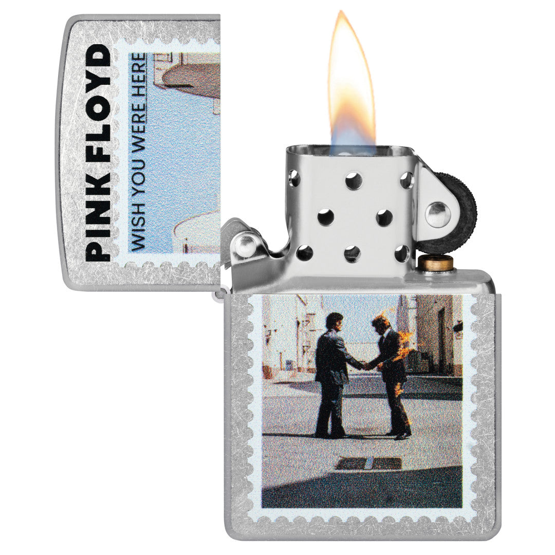 Zippo Pink Floyd Wish You Were Here Design Street Chrome Windproof Lighter with its lid open and lit.