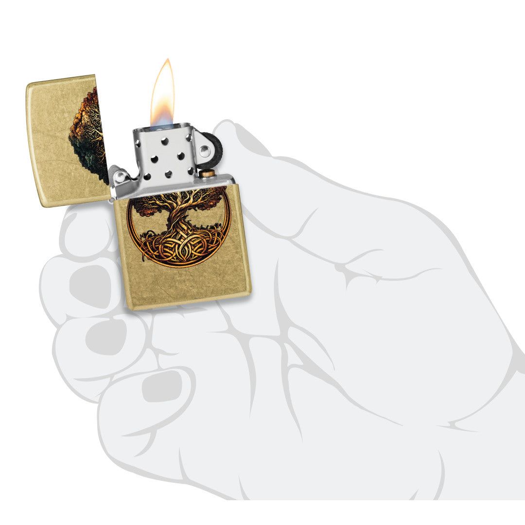 Zippo Knotted Tree of Life Design Street Brass Windproof Lighter lit in hand.