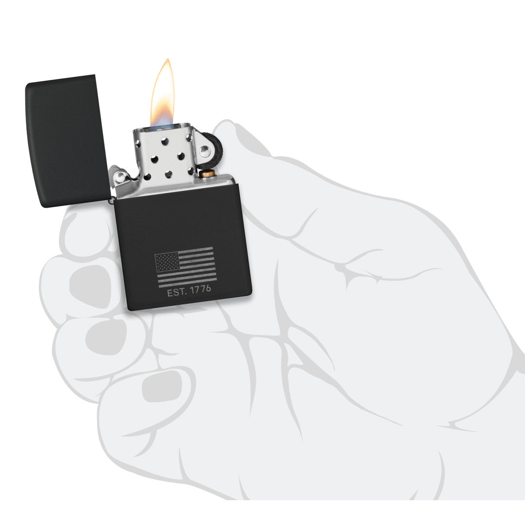 Zippo Because of the Brave Design Black Matte with Chrome Windproof Lighter lit in hand.