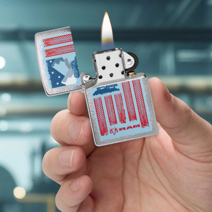 Zippo RAM Flag Design Brushed Chrome Windproof Lighter lit in hand.