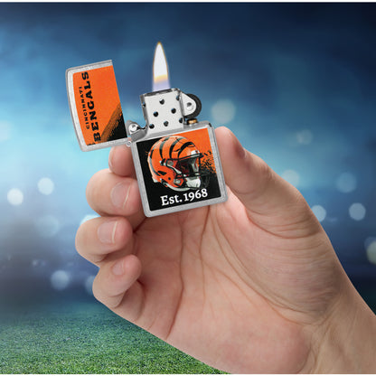 Zippo NFL Cincinnati Bengals Helmet Design Street Chrome Windproof Lighter lit in hand.