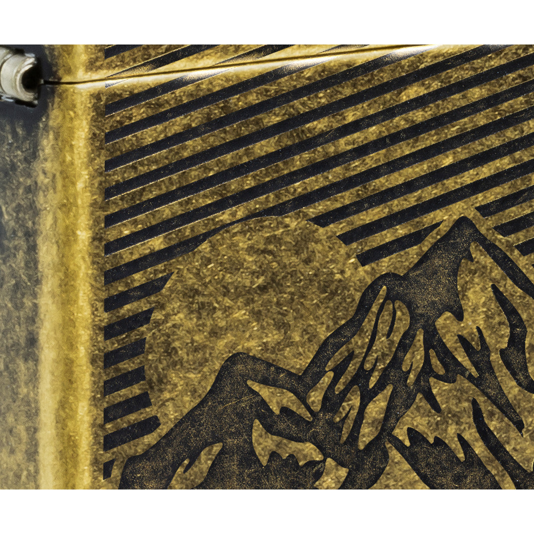 Front view of Zippo Etched Mountains Design Antique Brass Windproof Lighter close up to show the detail of the lighter.