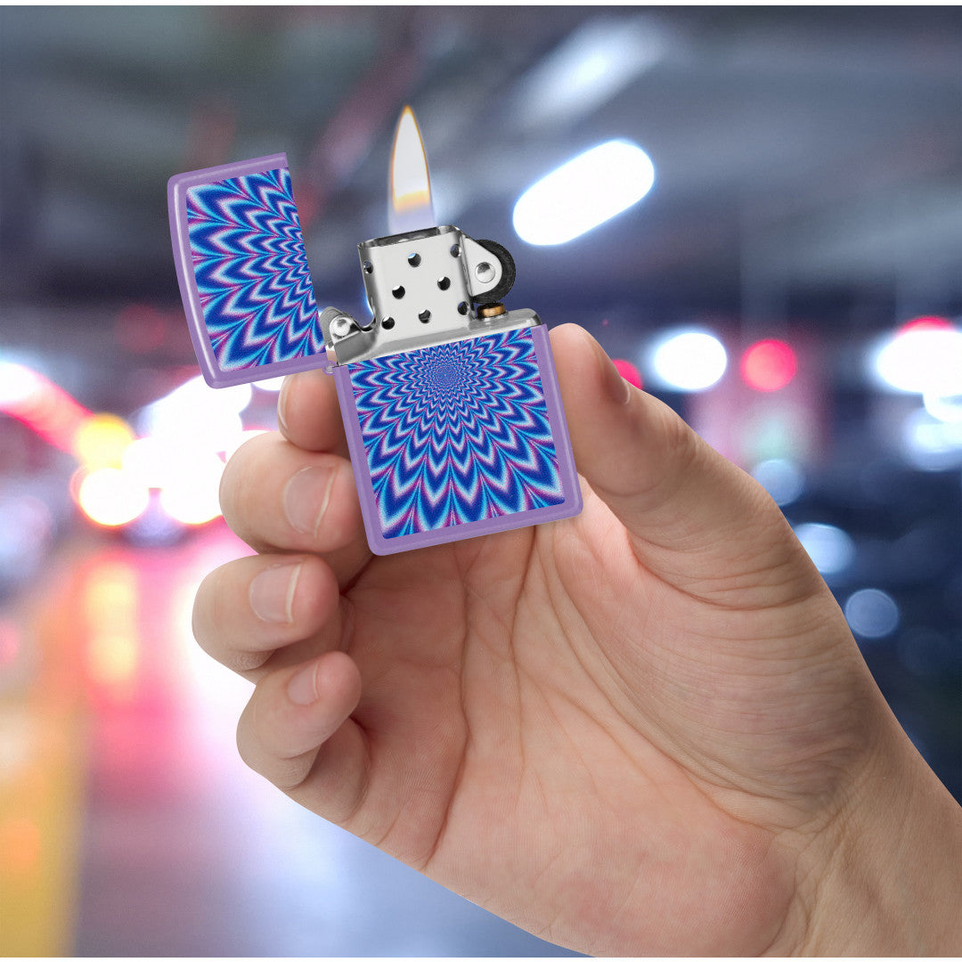 Zippo Lavender Illusion Design Smoky Lavender Windproof Lighter lit in hand.