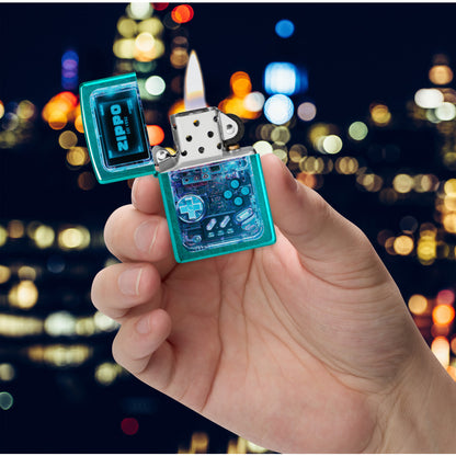 Zippo Game On Design Candy Teal Windproof Lighter lit in hand.