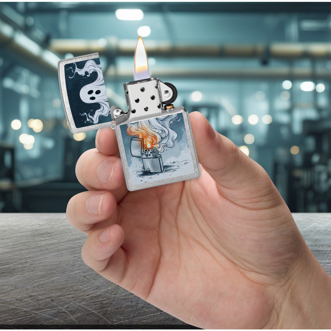 Zippo Spooky Spark Design Street Chrome Windproof Lighter lit in hand.