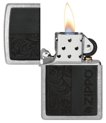 Zippo Black Leather Emblem - Zippo Design Street Chrome Windproof Lighter with its lid open and lit.