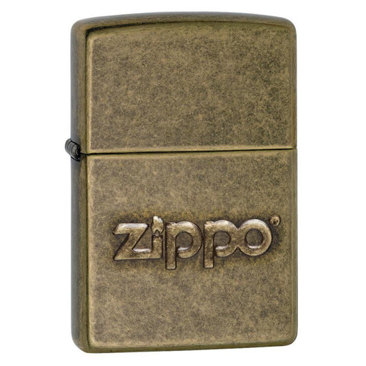 Front shot of Zippo Stamp Antique Brass Lighter standing at a 3/4 angle.