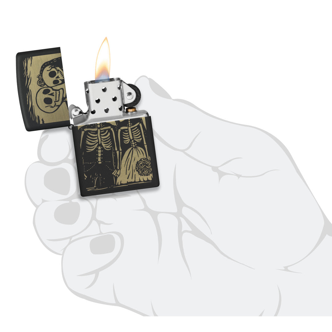 Zippo Skeleton Wedding Design Black Matte Windproof Lighter lit in hand.