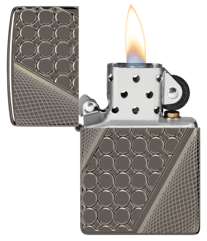 Zippo Deep Dots Design Armor® Black Ice® Windproof Lighter with its lid open and lit.