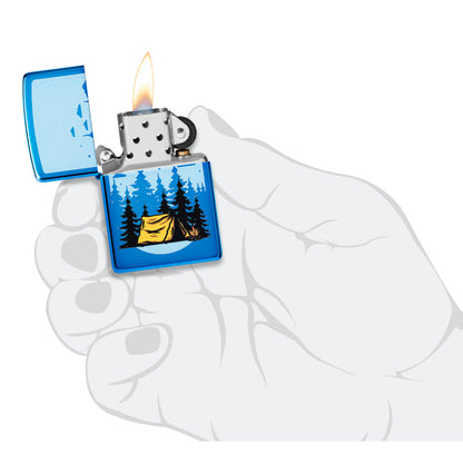 Zippo Forest Flicker Design High Polish Blue Windproof Lighter lit in hand.