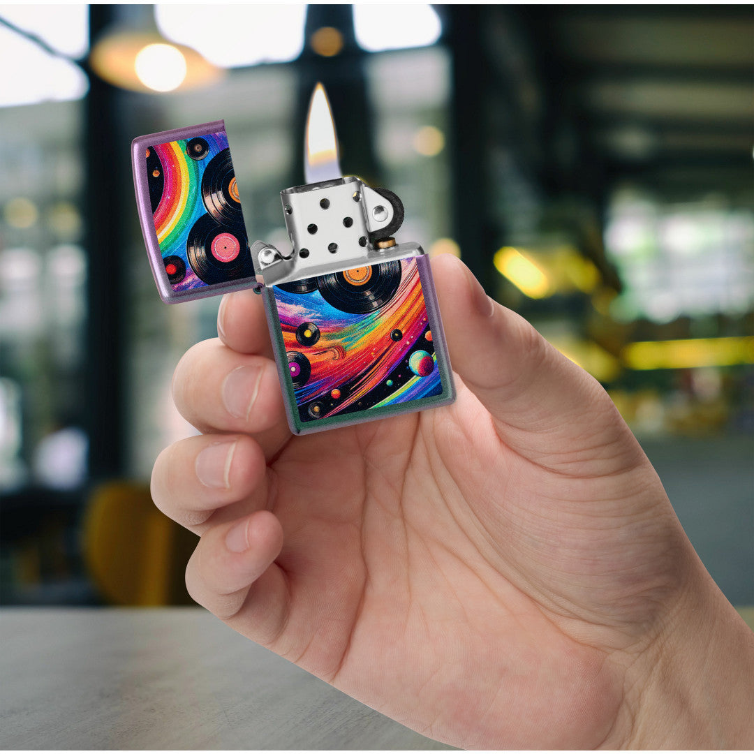 Zippo Rainbow Records Design Iridescent Windproof Lighter lit in hand.