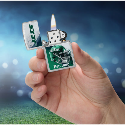 Zippo NFL New York Jets Helmet Design Street Chrome Windproof Lighter lit in hand.