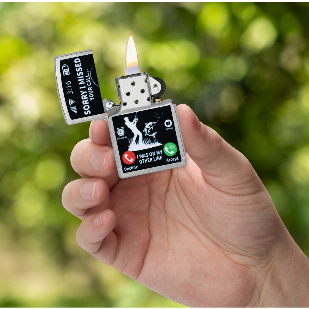 Zippo Other Line Design Street Chrome Windproof Lighter lit in hand.