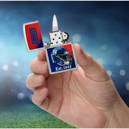 Zippo NFL New York Giants Helmet Design Street Chrome Windproof Lighter lit in hand.