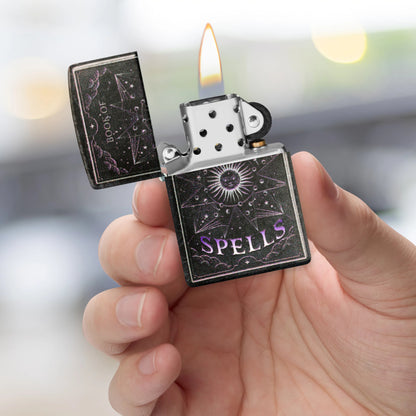 Zippo Mystic Book Design 540 Color Glow in the Dark Windproof Lighter
 lit in hand.