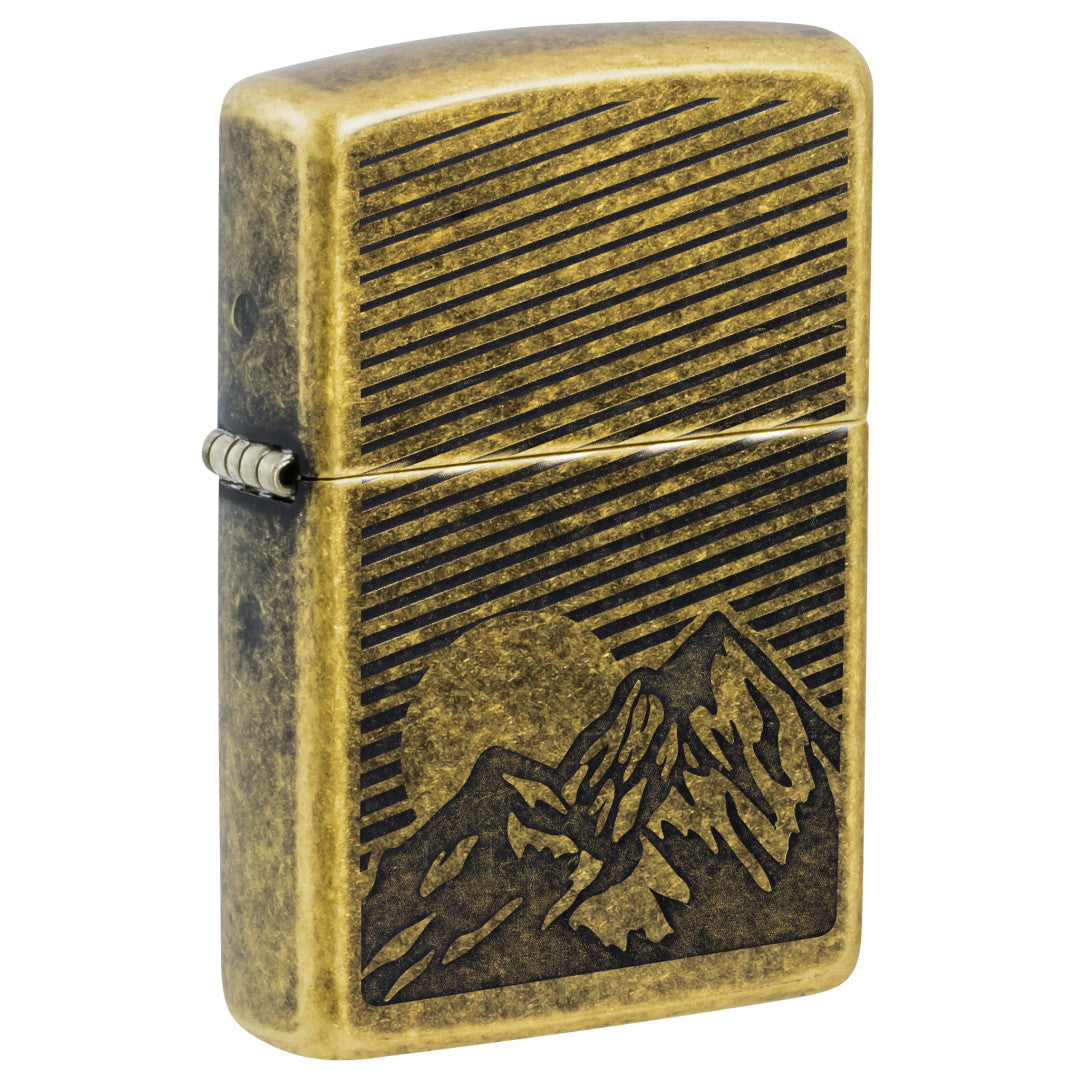 Front shot of Zippo Etched Mountains Design Antique Brass Windproof Lighter standing at a 3/4 angle.