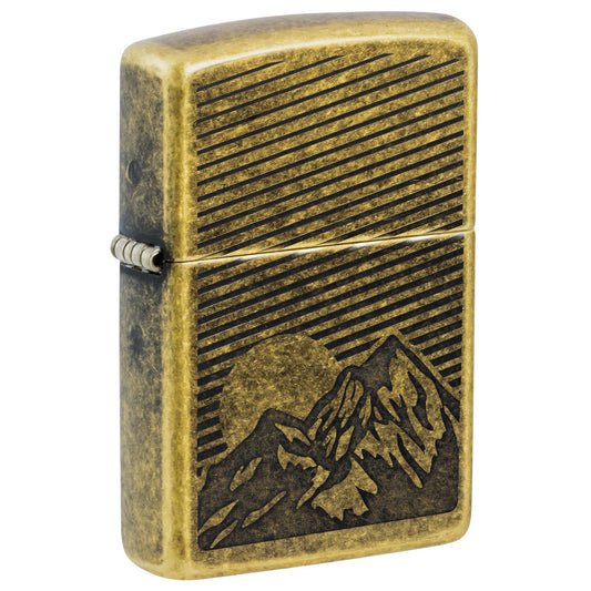 Front shot of Zippo Etched Mountains Design Antique Brass Windproof Lighter standing at a 3/4 angle.