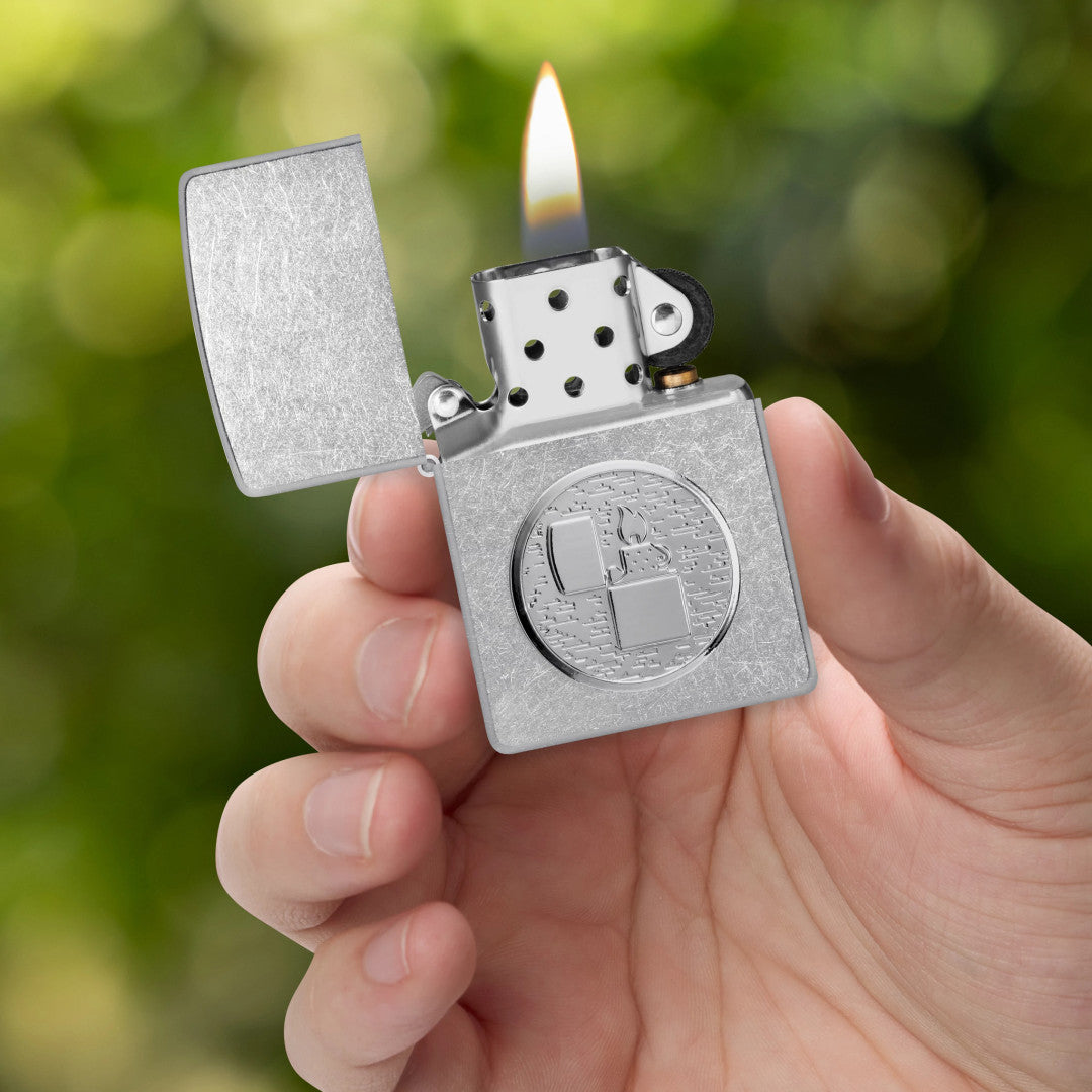 Zippo Golf Ball Marker Emblem – Lighter Design Street Chrome Windproof Lighter lit in hand.