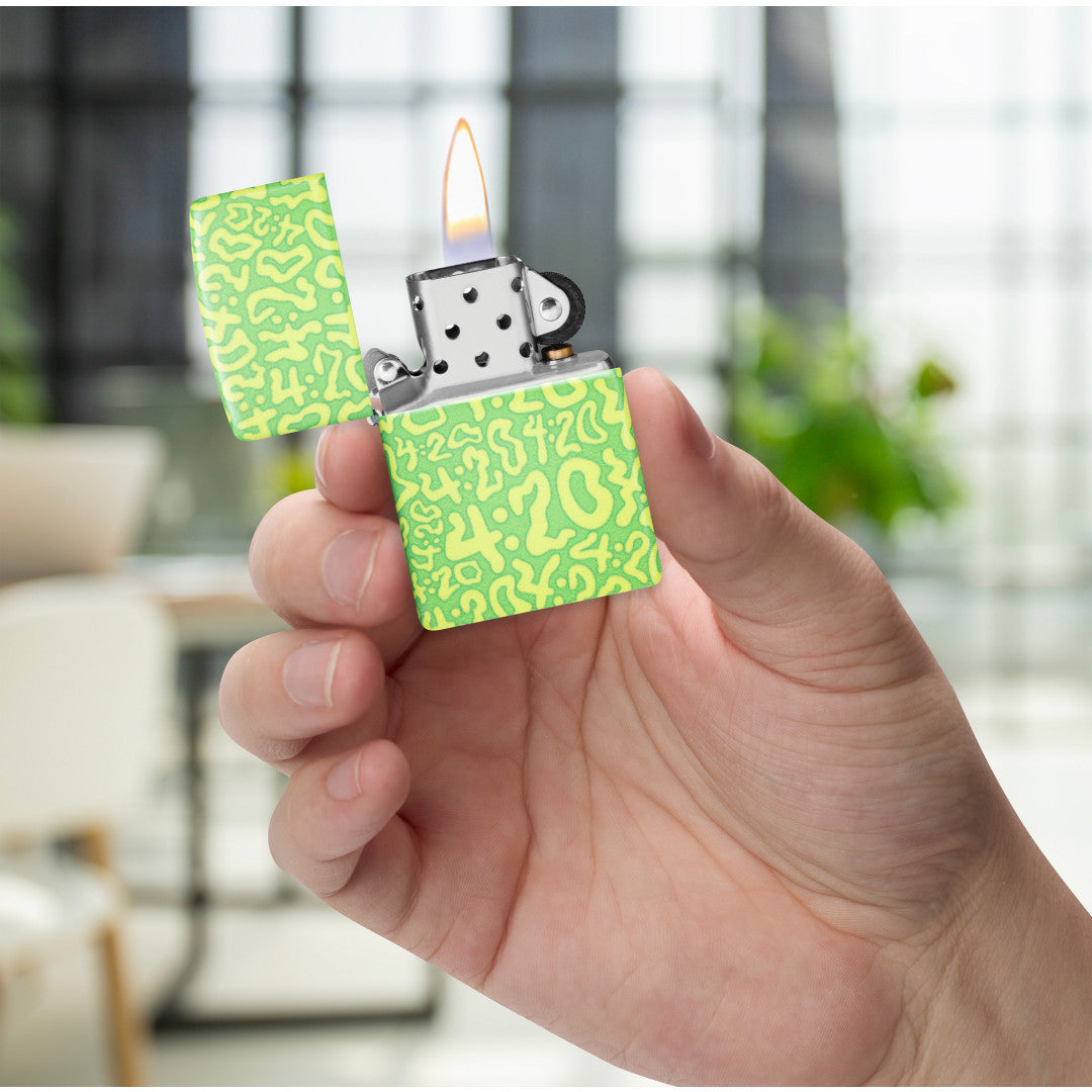 Zippo 420 Clouds Design 540 Matte Windproof Lighter lit in hand.