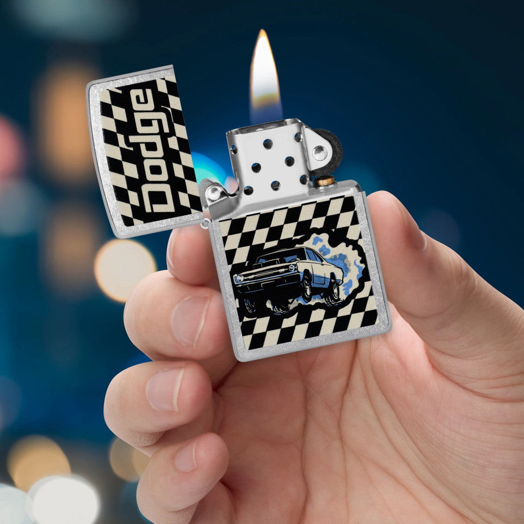 Zippo Dodge Dart Design Street Chrome Windproof Lighter lit in hand.