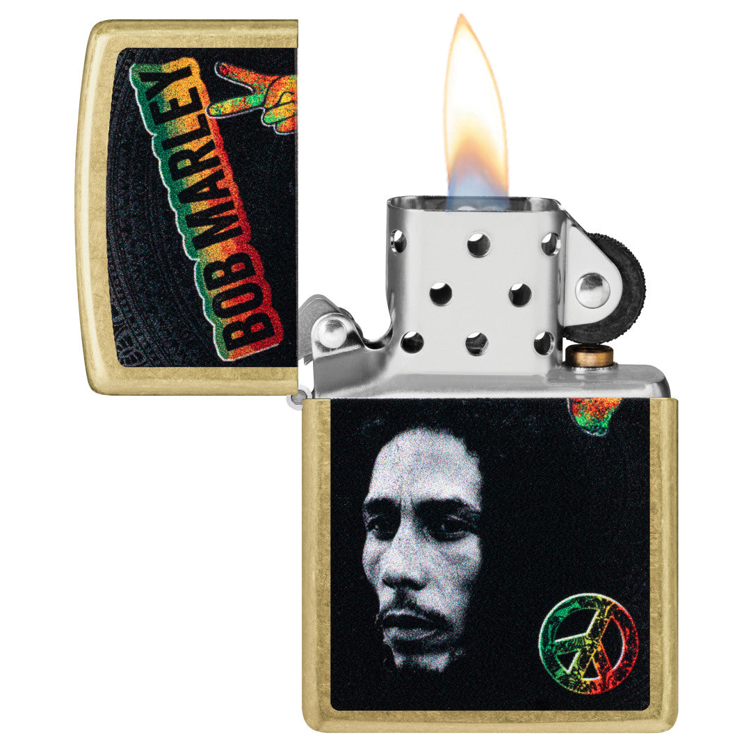 Zippo Bob Marley Peace Design Street Brass Windproof Lighter with its lid open and lit.