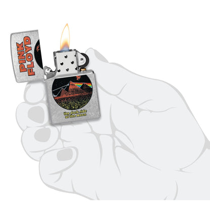 Zippo Pink Floyd Pyramids Design Street Chrome Windproof Lighter lit in hand.