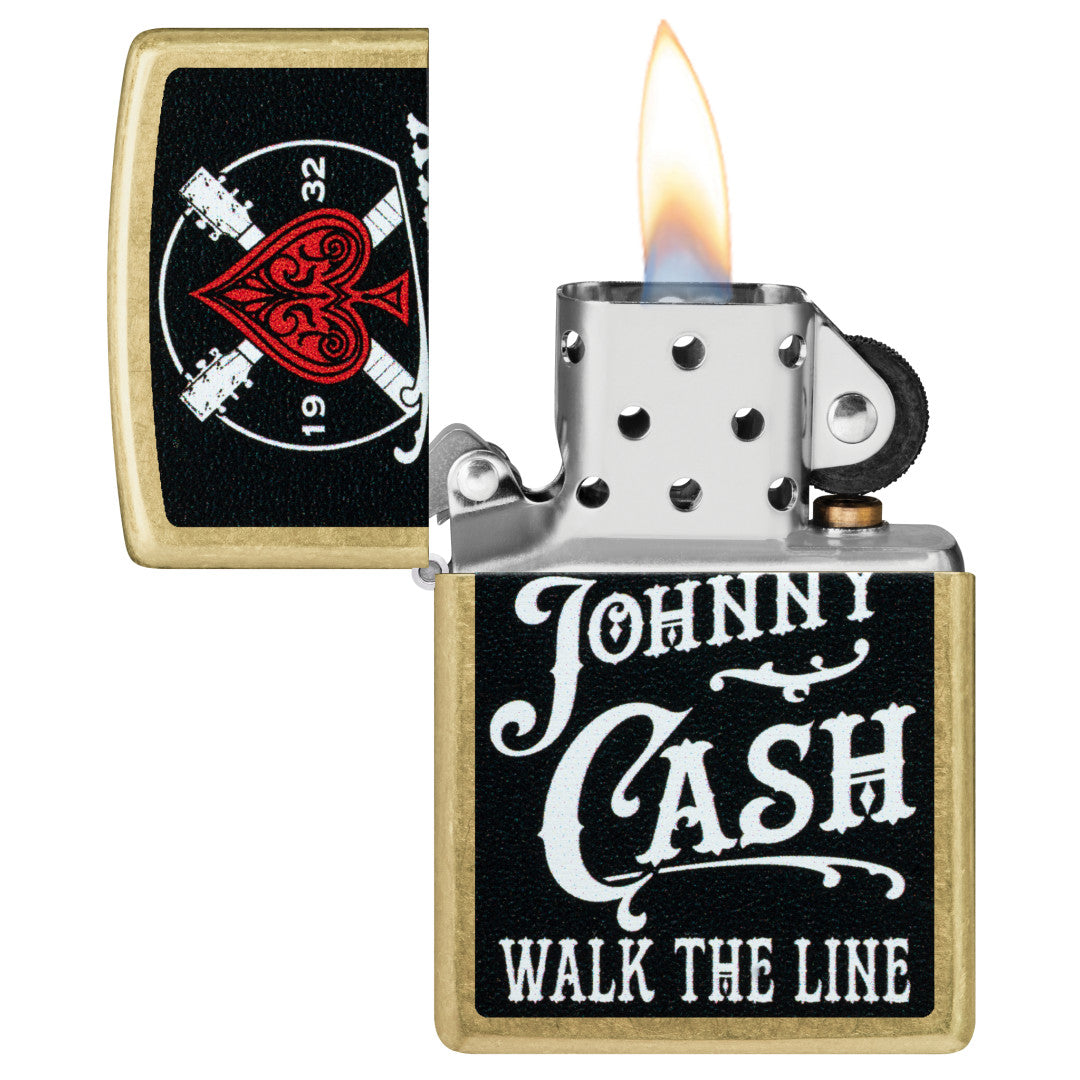 Zippo Johnny Cash 1932 Design Street Brass Windproof Lighter with its lid open and lit.