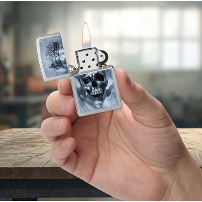 Zippo King Cranium Design Street Chrome Windproof Lighter lit in hand.