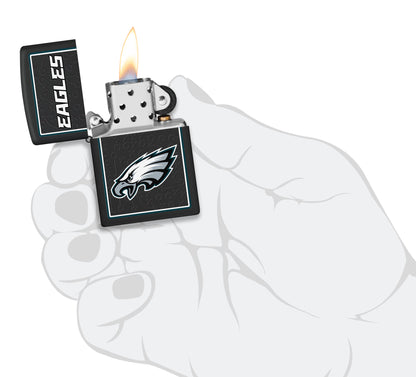 NFL Philadelphia Eagles Windproof Lighter lit in hand.