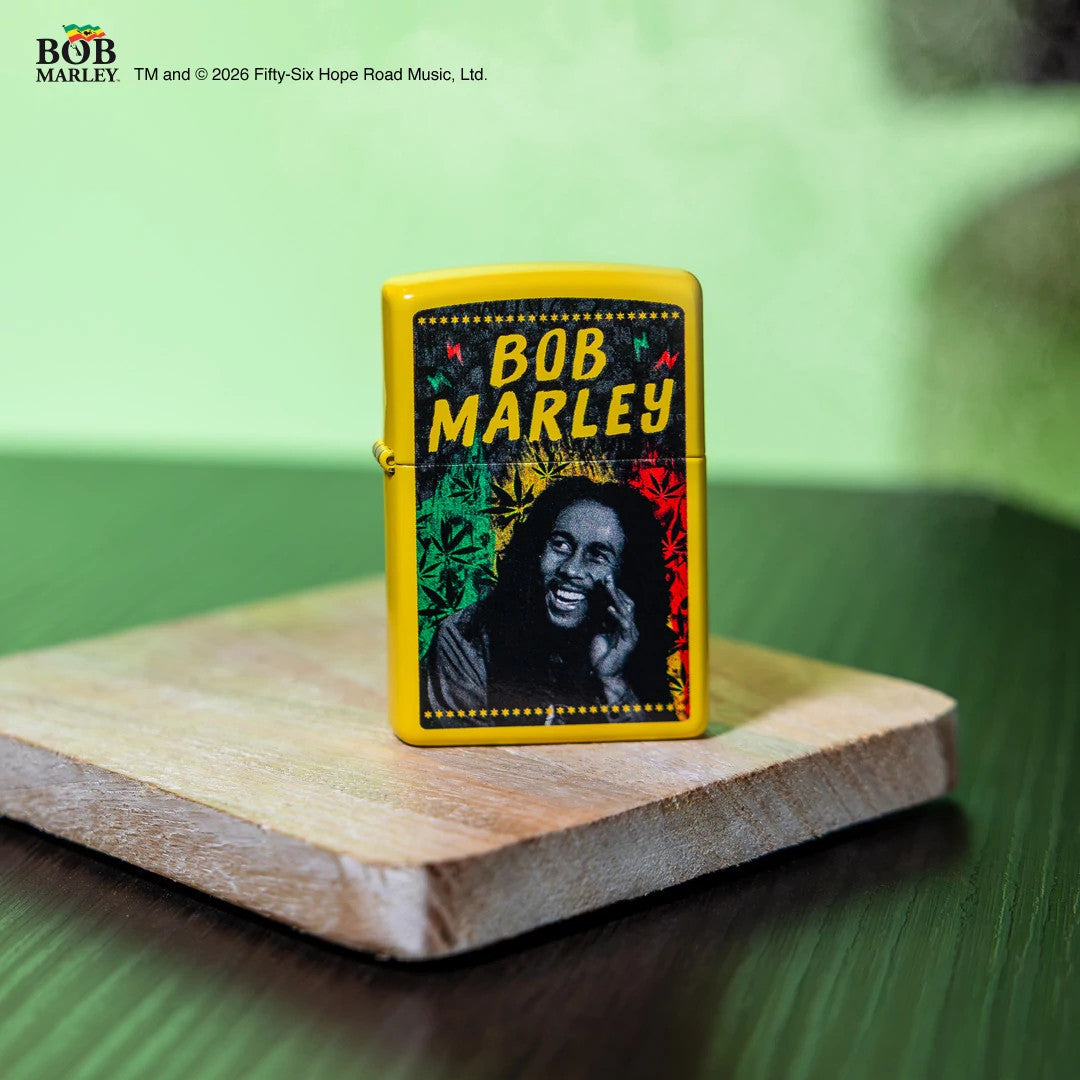 Bob Marley lighter with colorful design on a wooden surface