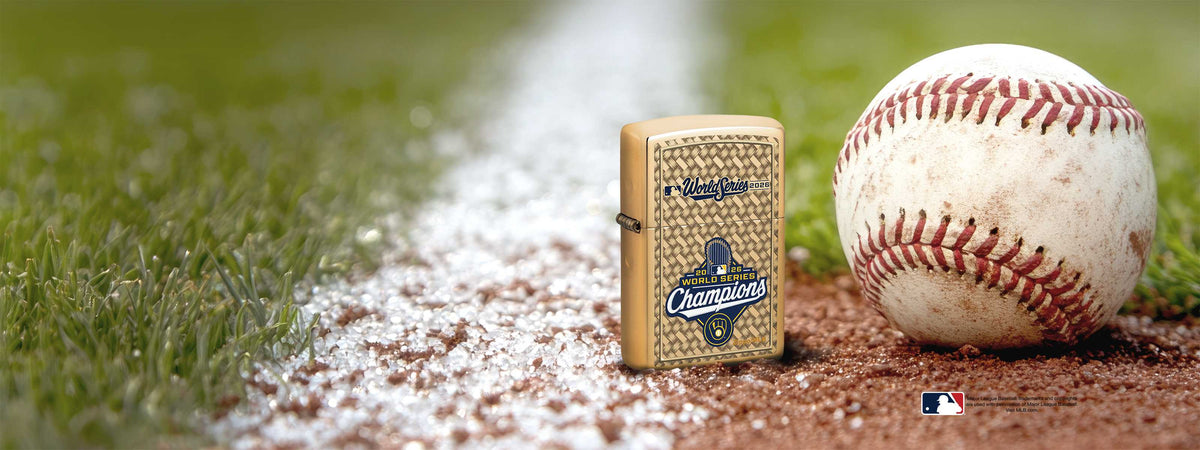 2026 World Series Milwaukee Brewers Zippo lighter on a baseball field next to a baseball.