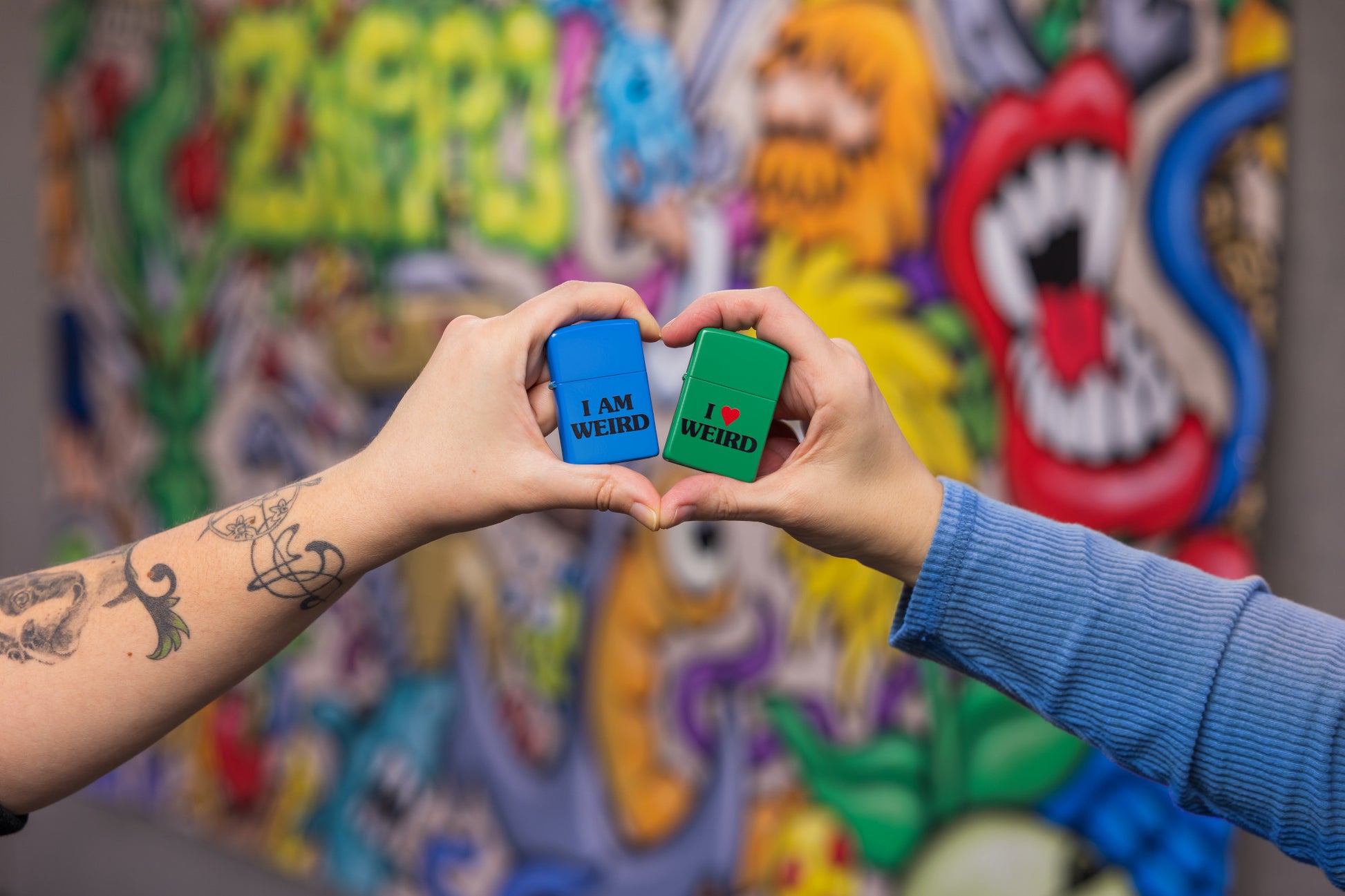 Lifestyle image of Love is Weird Lighters Set with a colorful background
