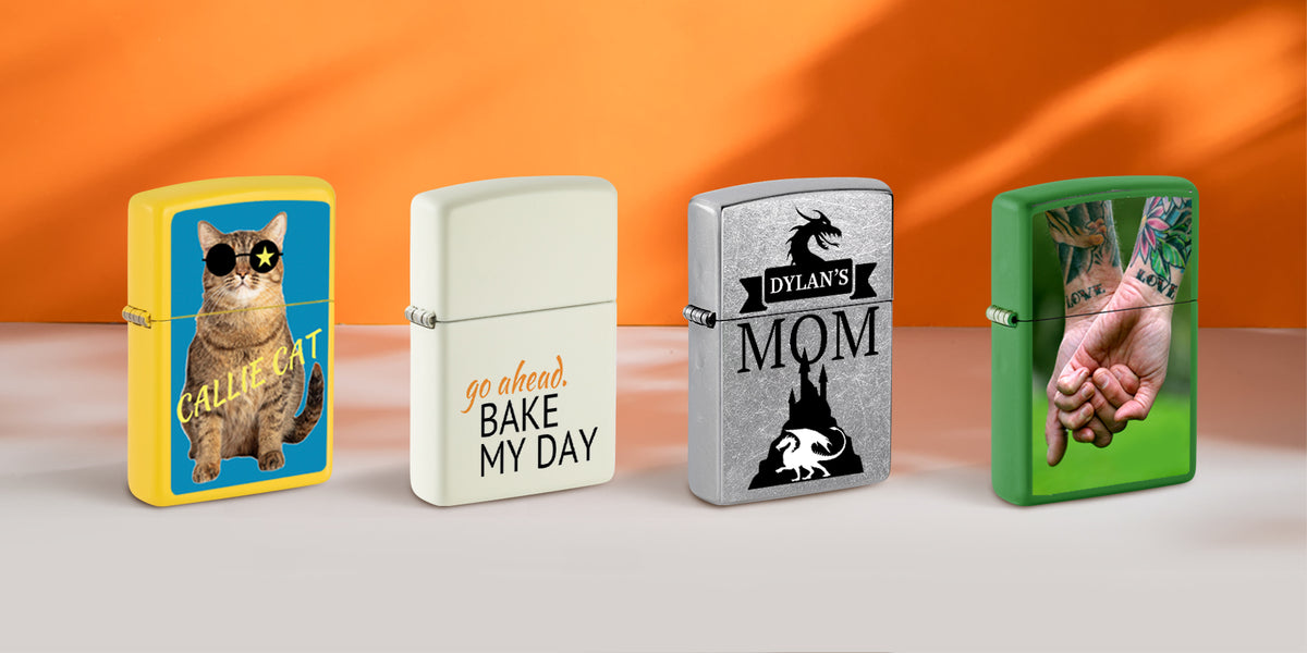 Four customized Zippo lighter cases displayed side by side against an orange and gray studio background. The cases feature different designs: a yellow case with a cat wearing sunglasses and the text 'CALL ME CAT', a cream case with 'go ahead BAKE MY DAY', a silver case with 'Dylan's MOM' and a dragon graphic, and a green case showing tattooed hands.