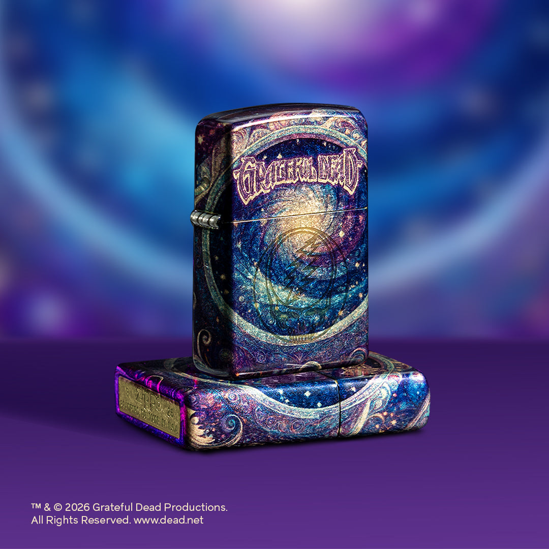 Two 2026 purple and blue Grateful Dead Zippo lighters in front of a purple background.