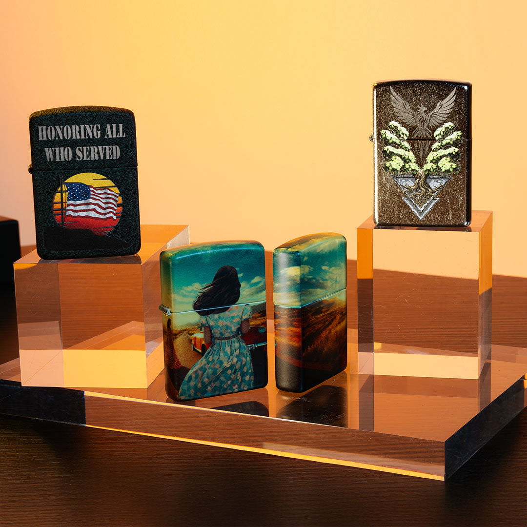 Three new web debut lighter designs on a display stand.