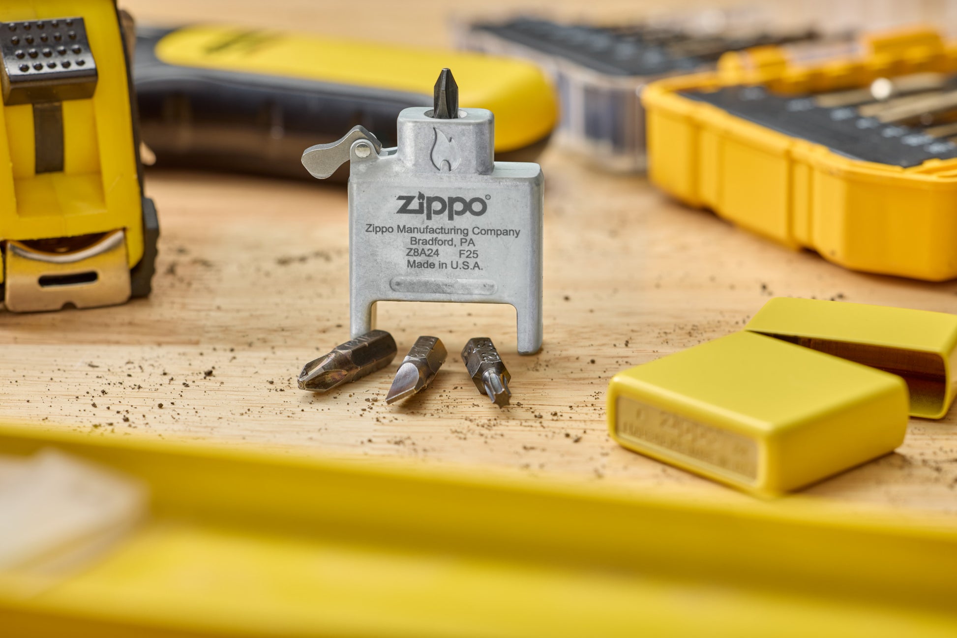 Lifestyle Image of Bit Safe Screwdriver USA standing on wood worktable with sunflower case and tools in the background.