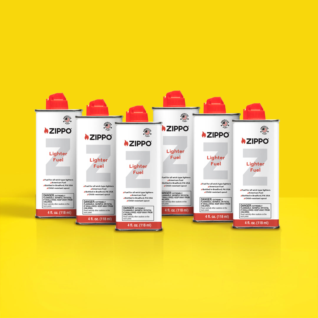 Six Zippo 4fl oz fuel cans on a yellow background