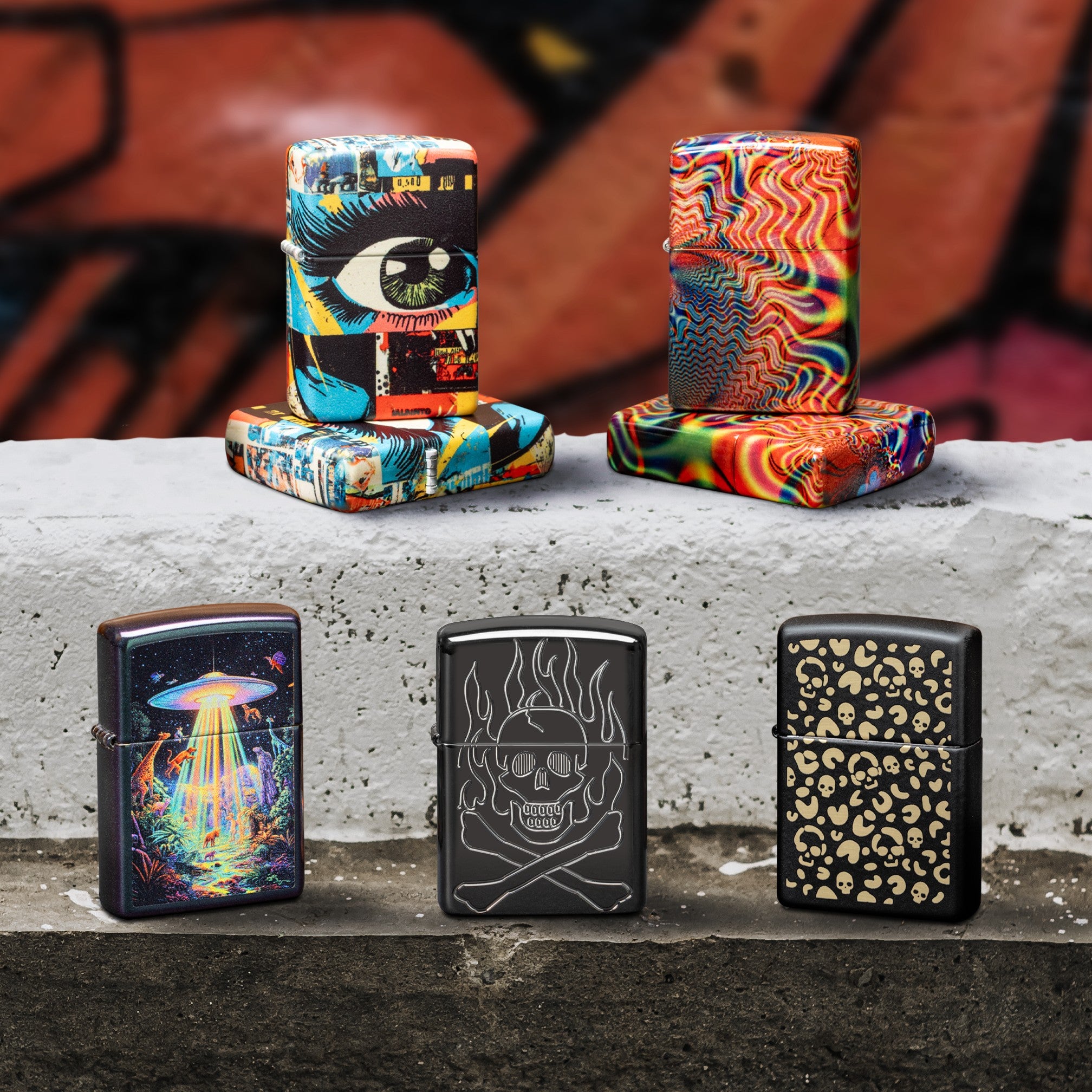 Zippo lighters with unique designs on a concrete surface