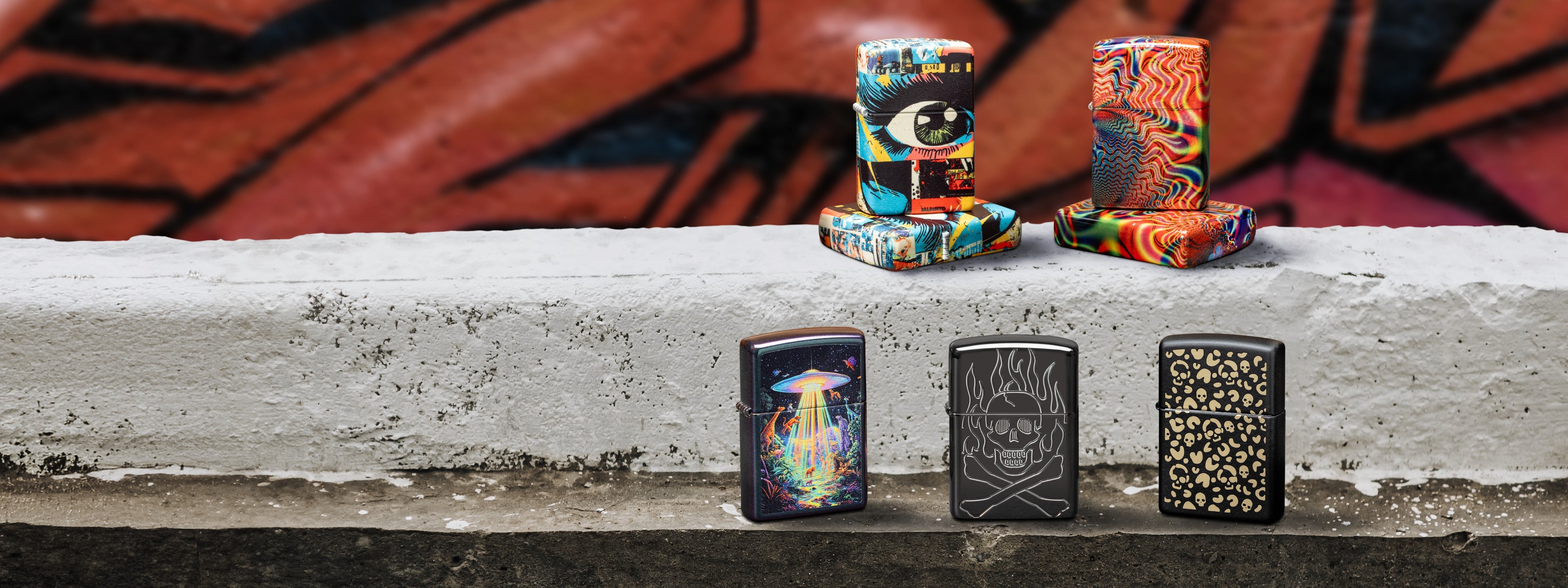 Zippo lighters on a concrete ledge with a graffiti background.