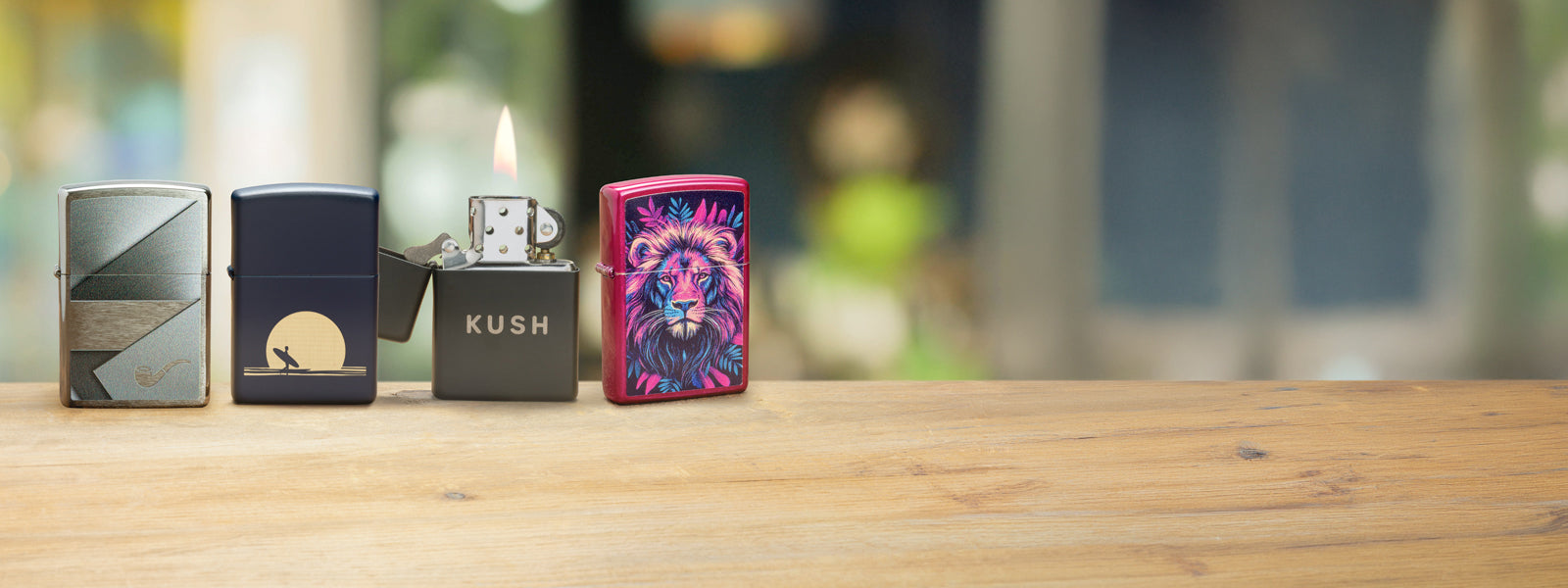 Four Spring Supplement Zippo lighters on a wooden surface with a blurred background