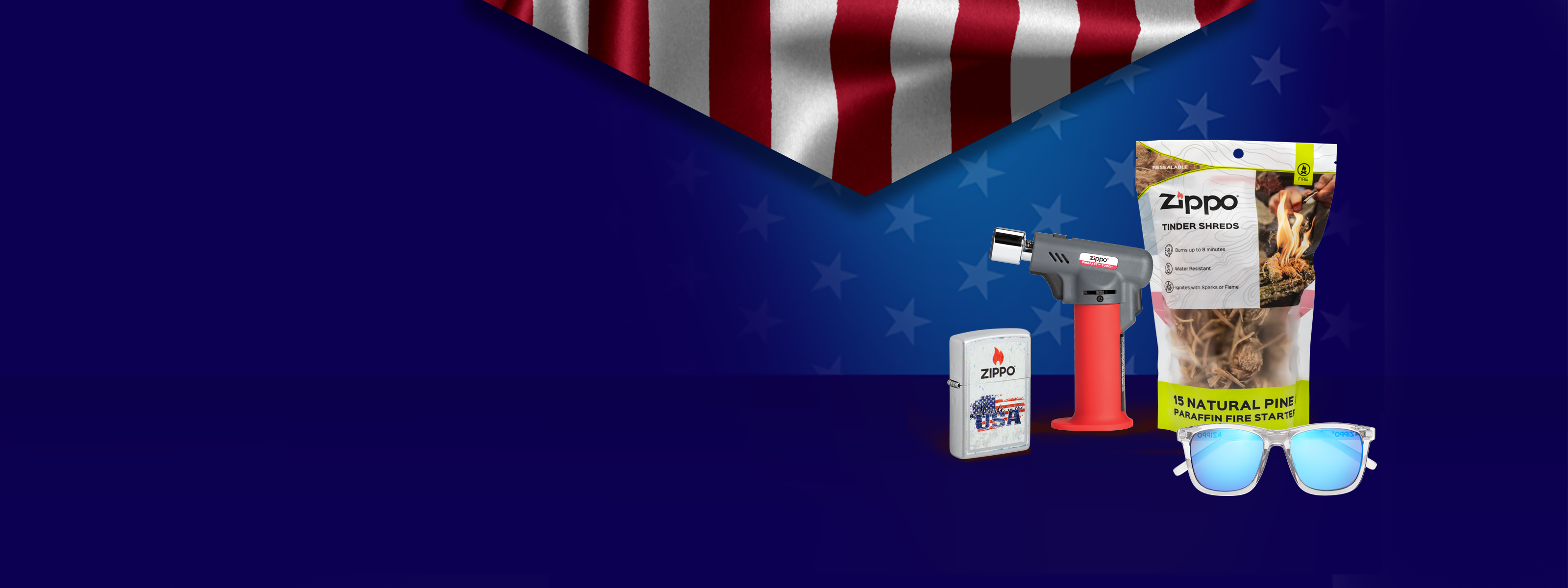 Zippo FireFast Torch, Tinder Shreds, Lighter and Sunglasses on a blue background with an American flag in the background. 