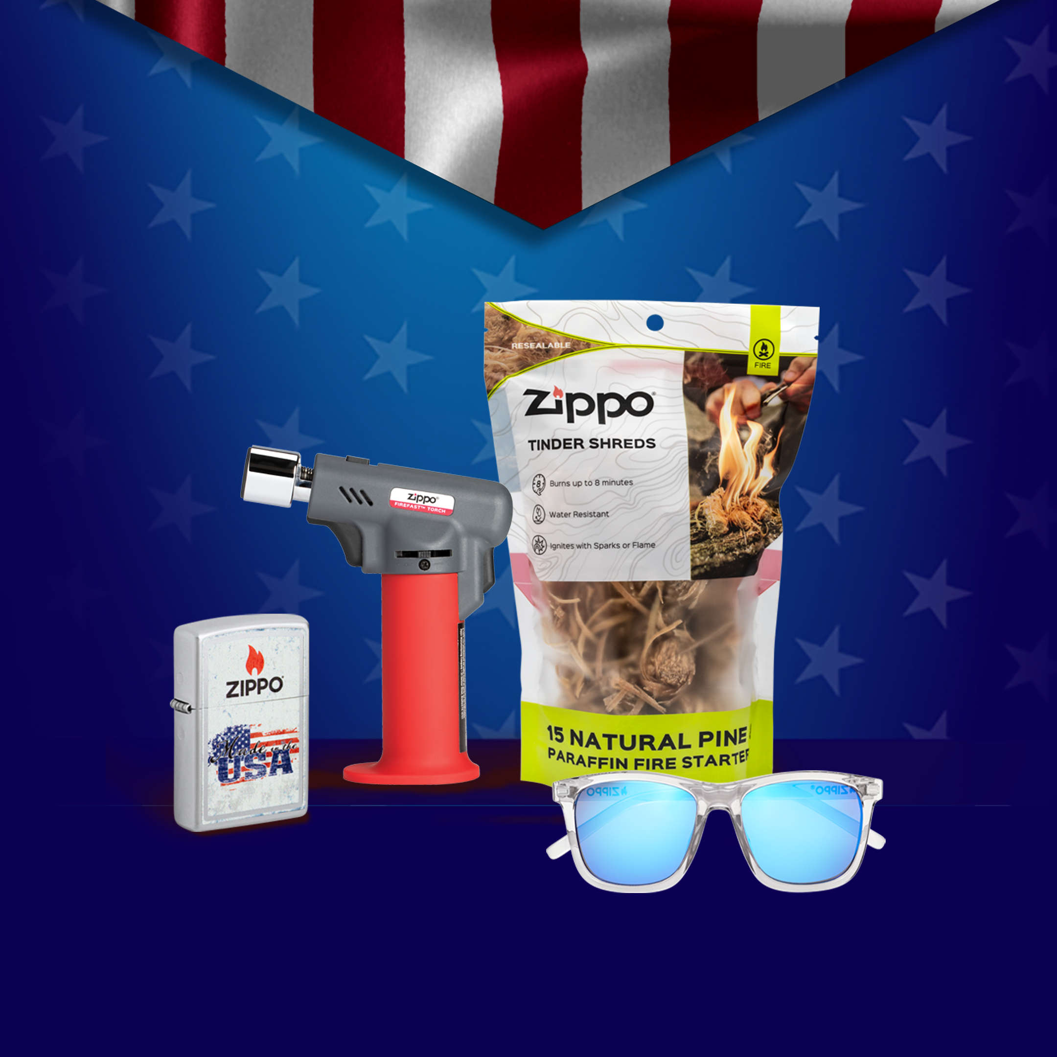 Zippo lighter, tinder shreds, Fire Fast Torch and sunglasses on a blue background with an American flag banner.