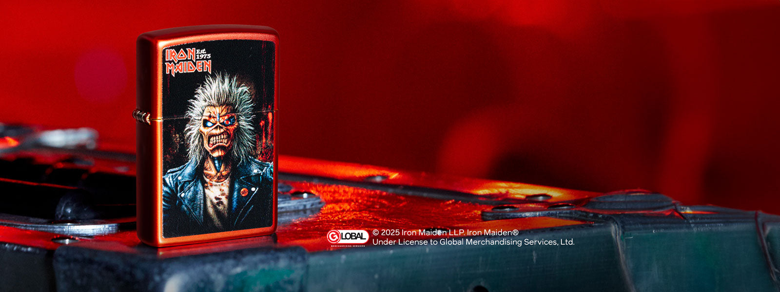 Iron Maiden Lighter with a graphic design on a red background