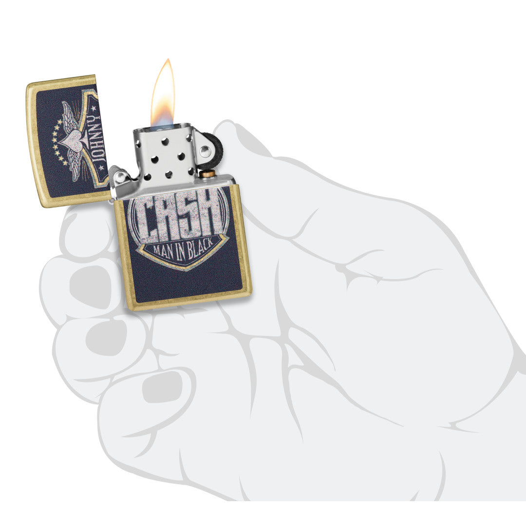 Zippo Johnny Cash Crest Design Street Brass Windproof Lighter lit in hand.