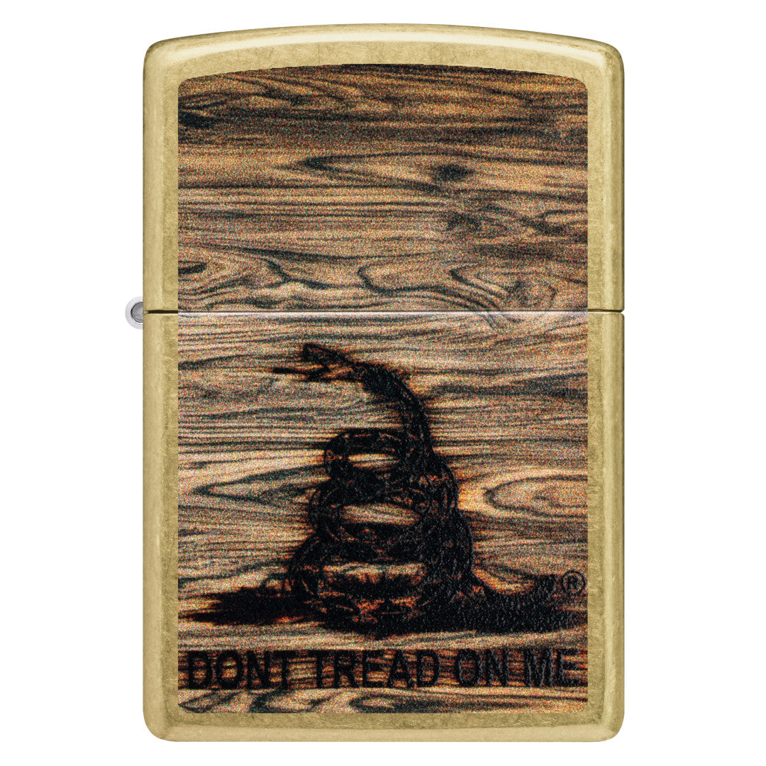 Front view of Zippo Don't Tread On Me® Woodburn Design Street Brass Windproof Lighter.