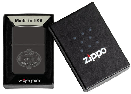 Zippo Plaque Design High Polish Black Windproof Lighter in its packaging.