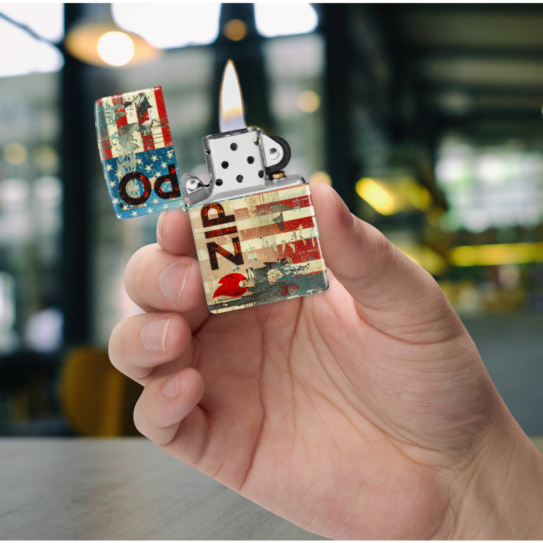 Zippo Flag Design 540 Matte Windproof Lighter lit in hand.